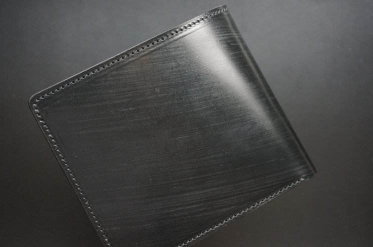 クレイトン社のブライドルレザーのブラックカラーの二つ折り財布（小銭入れ付き）の画像1